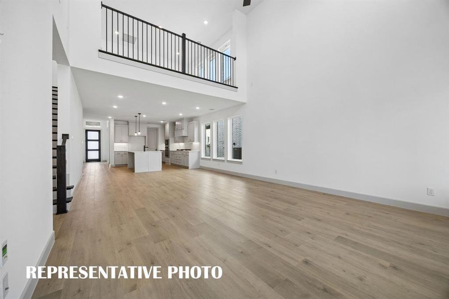 Featuring a game room open to the family room below, you'll enjoy dual level entertaining in our wonderful Orleans II plan.  REPRESENTATIVE PHOTO