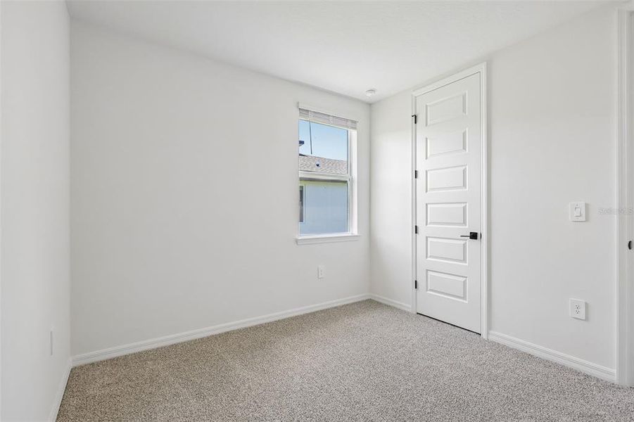 Spacious, unfurnished interior of a new home in The Grove at Stuart Crossing - Signature Series, Bartow (Image 29).