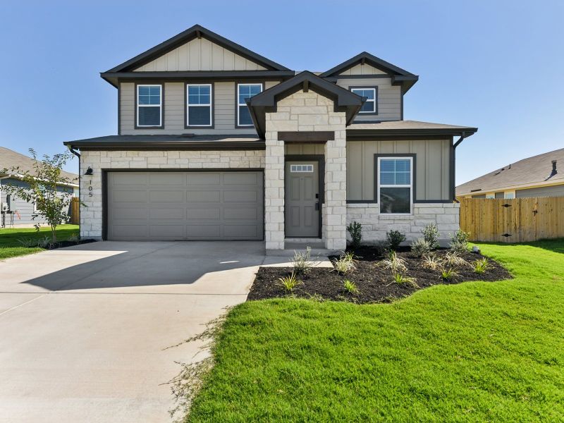 Front exterior of a new home in Riverbend at Double Eagle - Reserve Collection, Cedar Creek, TX, highlighting curb appeal (Image 2). Front exterior of a new home in Riverbend at Double Eagle - Reserve Collection, Cedar Creek, TX, highlighting curb appeal (Image 2).