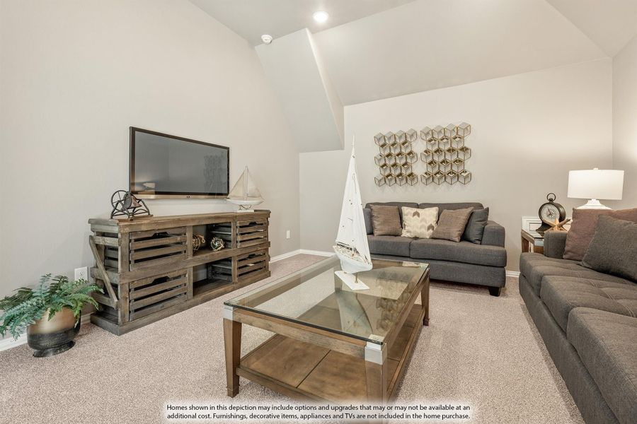 Living room with vaulted ceiling, gray sofas, glass coffee table, and rustic wood TV console on beige carpet Living room with vaulted ceiling, gray sofas, glass coffee table, and rustic wood TV console on beige carpet