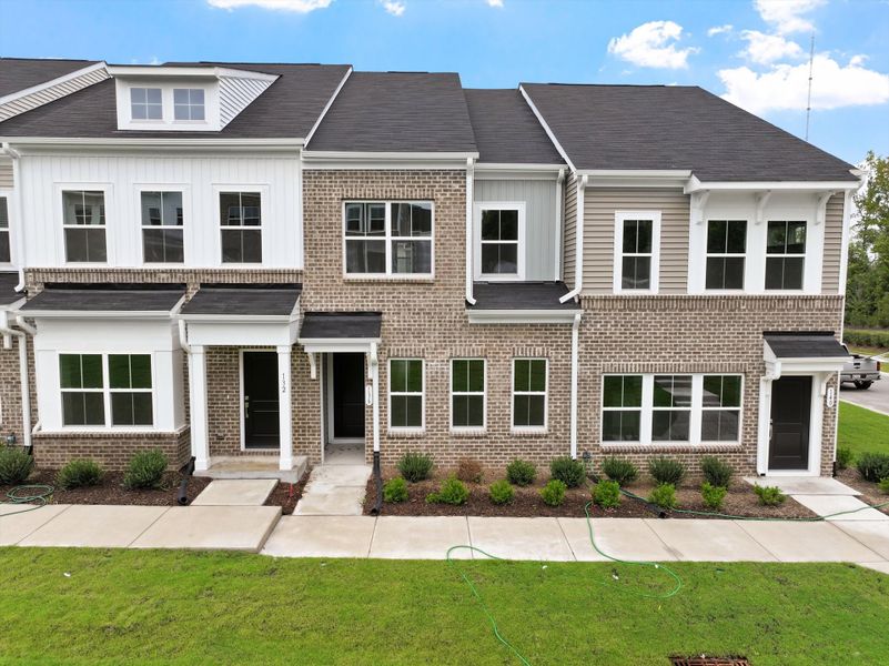Front exterior of a new home in Renaissance at White Oak, Garner, NC, highlighting curb appeal (Image 2). Front exterior of a new home in Renaissance at White Oak, Garner, NC, highlighting curb appeal (Image 2).