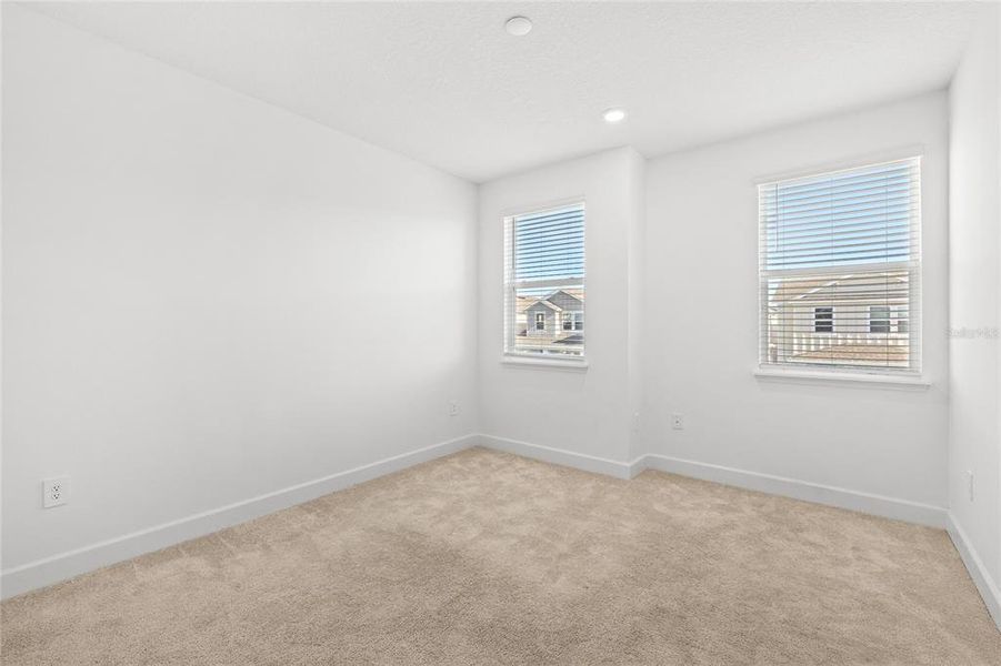 Spacious, unfurnished interior of a new home in Harvest At Ovation 50s, Winter Garden (Image 28).