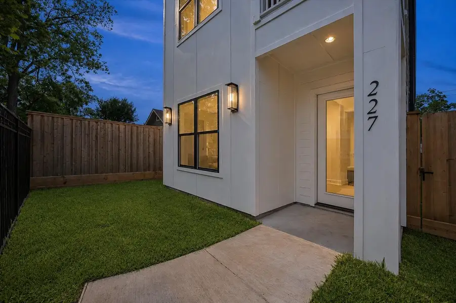 The covered front entry creates a more private arrival into the home while connecting naturally to the surrounding outdoor space. Clean architectural lines and warm finishes continue from the exterior into the interior layout. The covered front entry creates a more private arrival into the home while connecting naturally to the surrounding outdoor space. Clean architectural lines and warm finishes continue from the exterior into the interior layout.