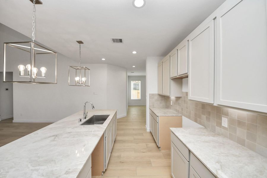 This generously spacious kitchen is a dream realized! v