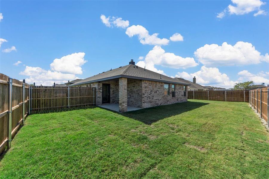 View of yard with a patio area