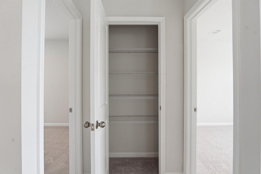 Spacious, unfurnished interior of a new home in Sanctuary Cove at Cane Bay, Summerville (Image 43).