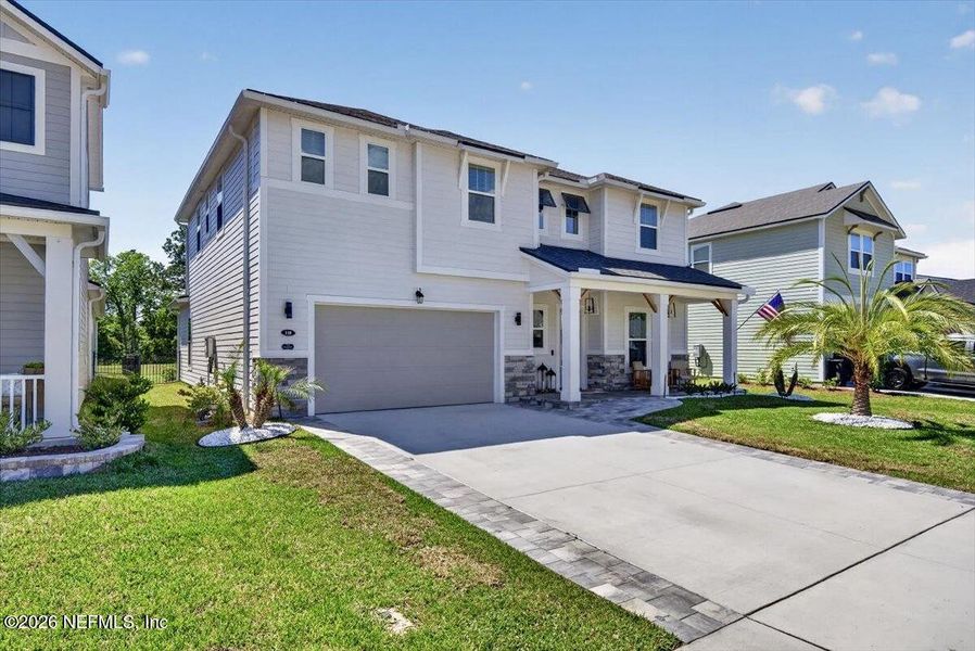 Front exterior of a new home in , St. Johns, FL, highlighting curb appeal (Image 24).