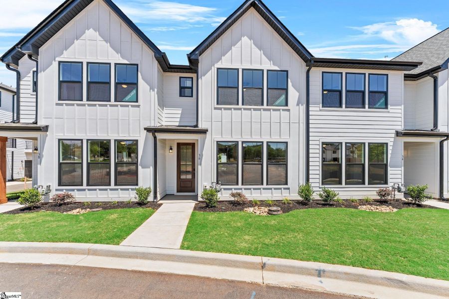 Front exterior of a new home in Renaissance Place, Greenville, SC, highlighting curb appeal (Image 2). Front exterior of a new home in Renaissance Place, Greenville, SC, highlighting curb appeal (Image 2).