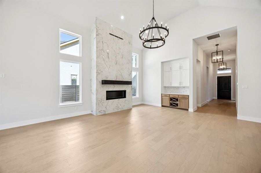 Featuring a built in buffet, floor to ceiling windows and a fireplace, you will be dining in style when you call this dream home your own!