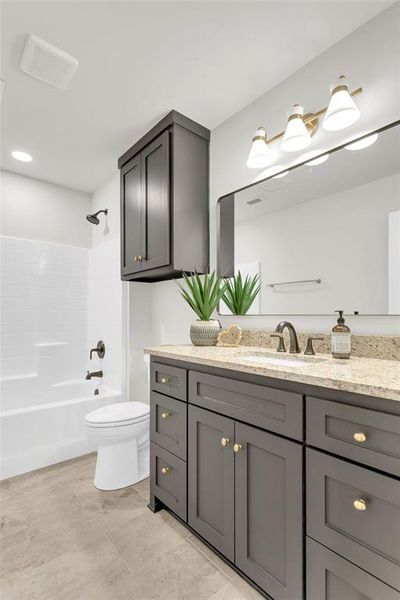 Bathroom with vanity and washtub / shower combination Bathroom with vanity and washtub / shower combination