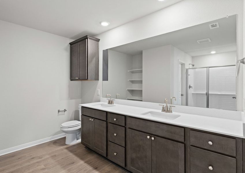The master bathroom has a large dual-sink vanity. The master bathroom has a large dual-sink vanity.