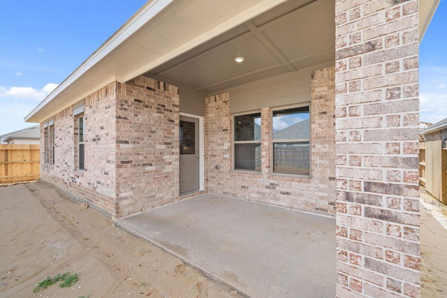 Exterior details and patio area of a home in Windrose Green 50', Angleton (Image 4).