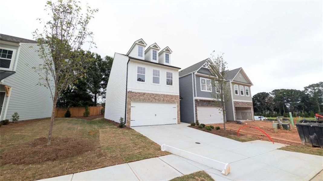 Front exterior of a new home in Owen Preserve, Canton, GA, highlighting curb appeal (Image 19).