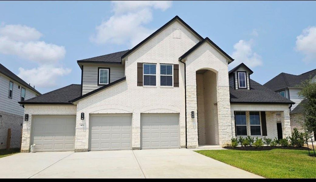 Front exterior of a new home in Beacon Hill, Waller, TX, highlighting curb appeal (Image 10). Front exterior of a new home in Beacon Hill, Waller, TX, highlighting curb appeal (Image 10).