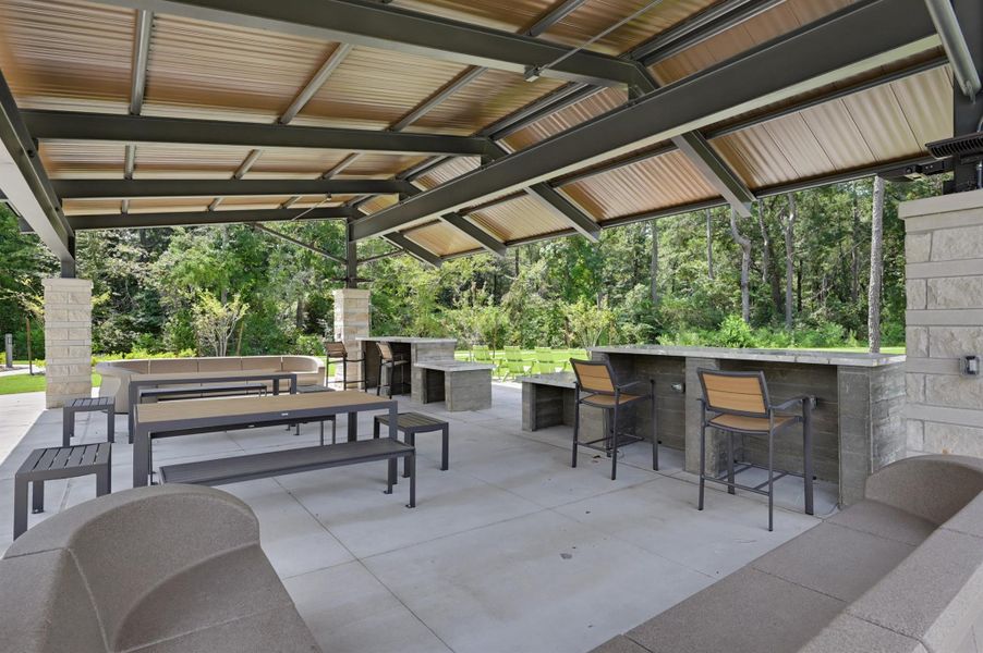 This section has an outdoor lounge area with picnic tables and high top bars. This section has an outdoor lounge area with picnic tables and high top bars.