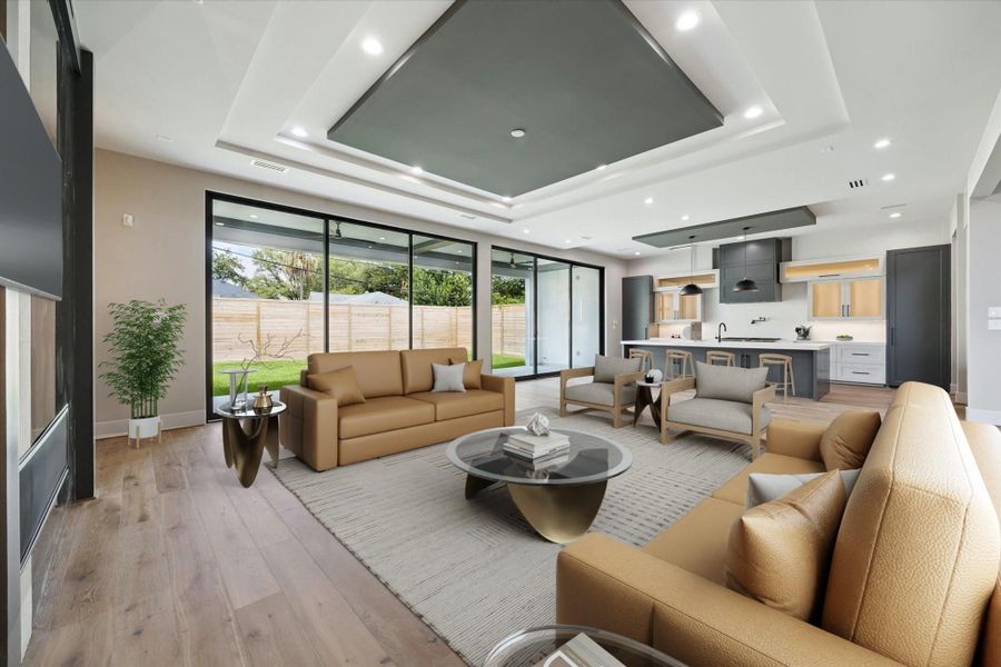 A wall of glass sliding doors floods the space with natural light and seamlessly connects to the outdoors, while rich oak flooring flows effortlessly into the open kitchen, creating a perfect setting for both entertaining and everyday living.