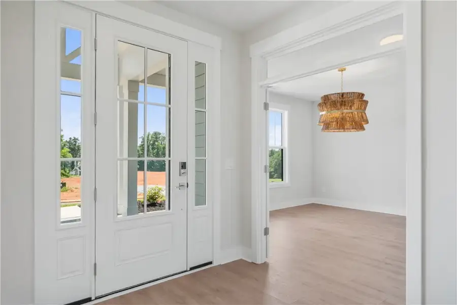 A welcoming entry features a stylish door with sid A welcoming entry features a stylish door with sid