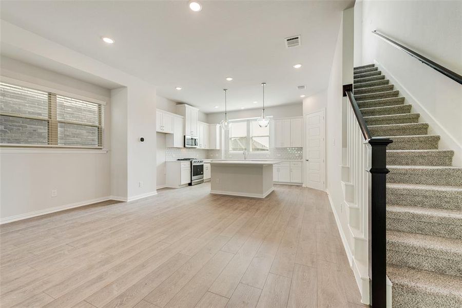 Unfurnished living room with light hardwood / wood-style flooring