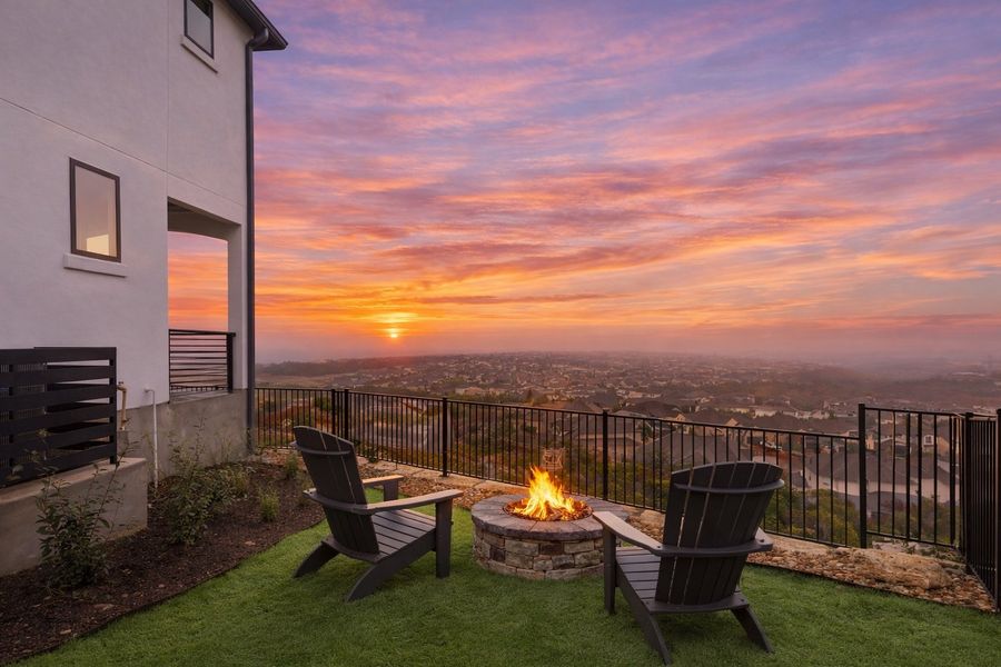 Exterior details and patio area of a home in The Point at Rough Hollow, Lakeway (Image 3).