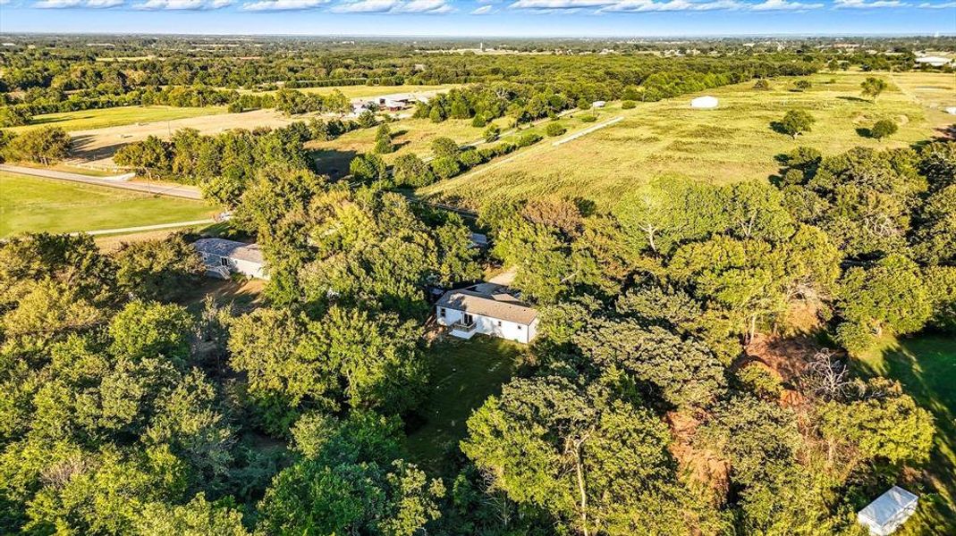Aerial view of property's location featuring a forest Aerial view of property's location featuring a forest