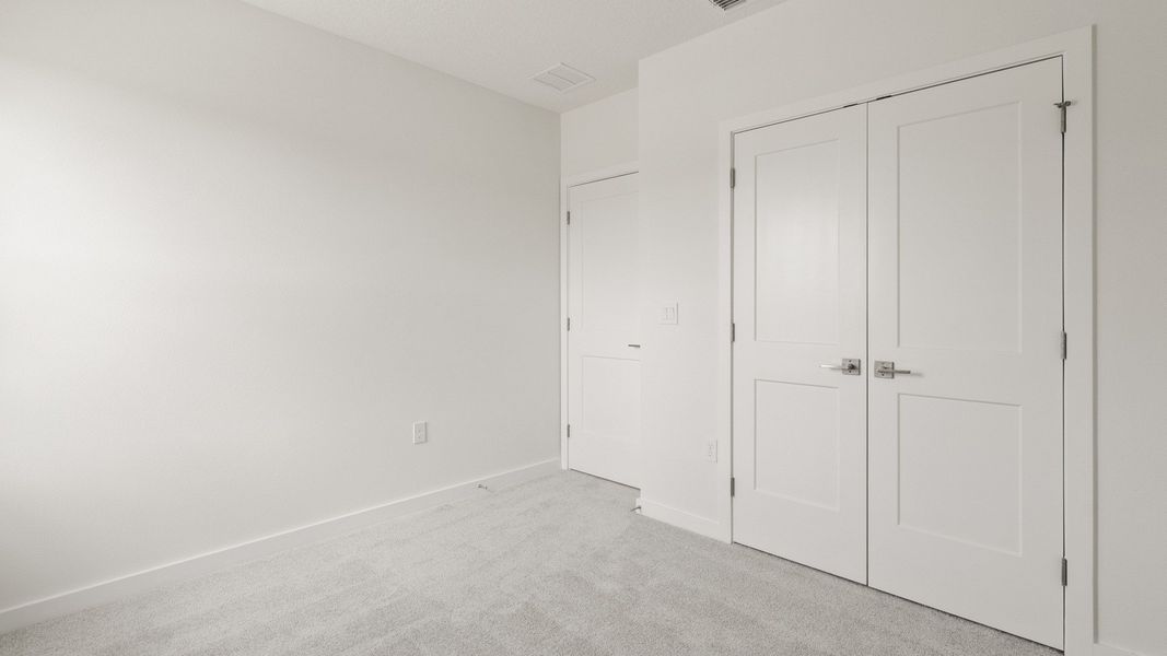 Second Bedroom with spacious closet in the Flagler by DRB Homes in Hamilton Bluff Second Bedroom with spacious closet in the Flagler by DRB Homes in Hamilton Bluff