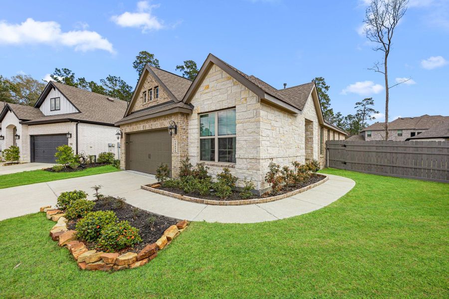 Front exterior of a new home in Artavia: Avante Collection, Conroe, TX, highlighting curb appeal (Image 24).