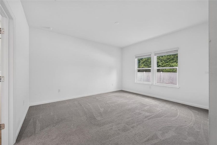Spacious, unfurnished interior of a new home in Heath Preserve, Ocala (Image 48).