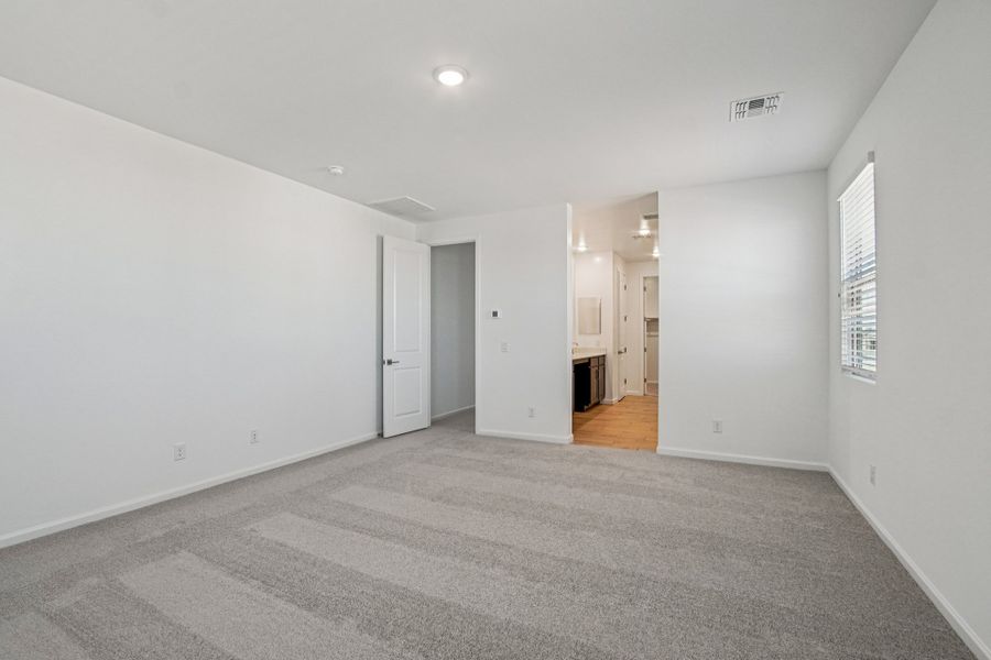 Primary suite. Finishes and options may vary by community