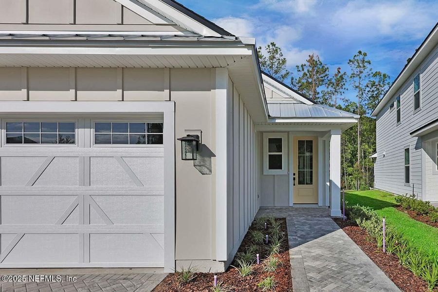 Front exterior of a new home in Reflections at Nocatee, Ponte Vedra, FL, highlighting curb appeal (Image 22). Front exterior of a new home in Reflections at Nocatee, Ponte Vedra, FL, highlighting curb appeal (Image 22).