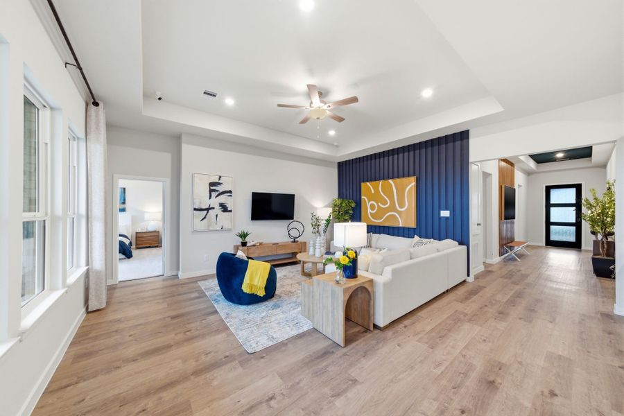 A living room with a wood floor. A living room with a wood floor.