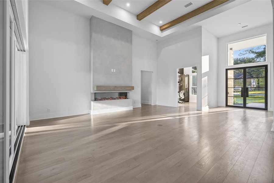 Open sightlines connect the living room to the kitchen and surrounding spaces for easy everyday living and entertaining. **Images are from a previously completed project. **