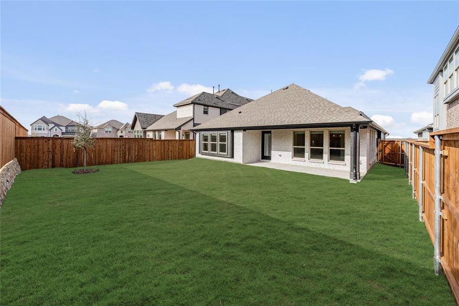 Exterior details and patio area of a home in Creekview Meadows, Pilot Point (Image 4).