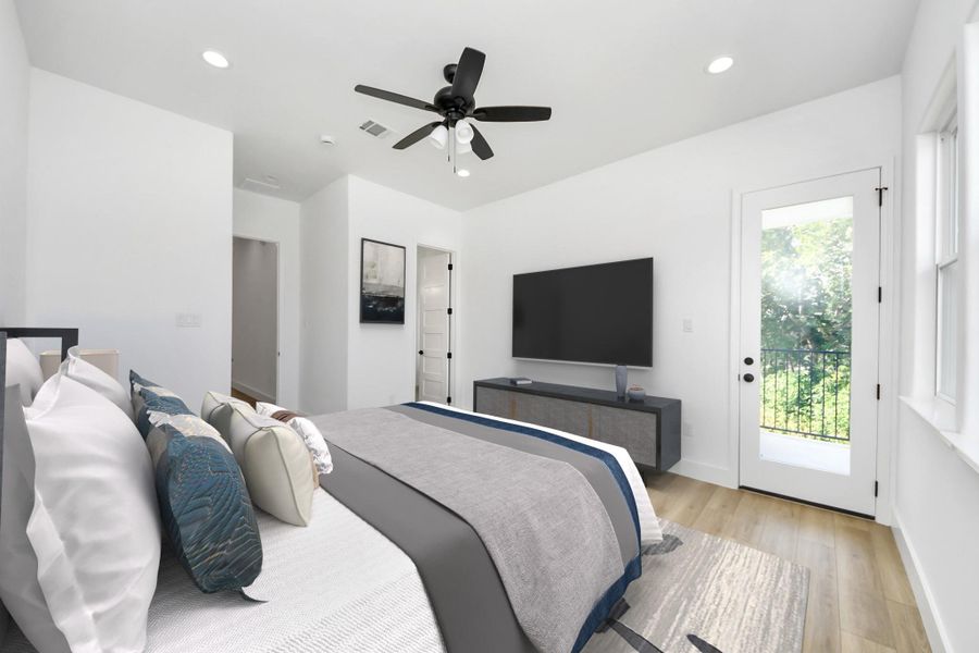 Spacious primary bedroom w/ private balcony.
