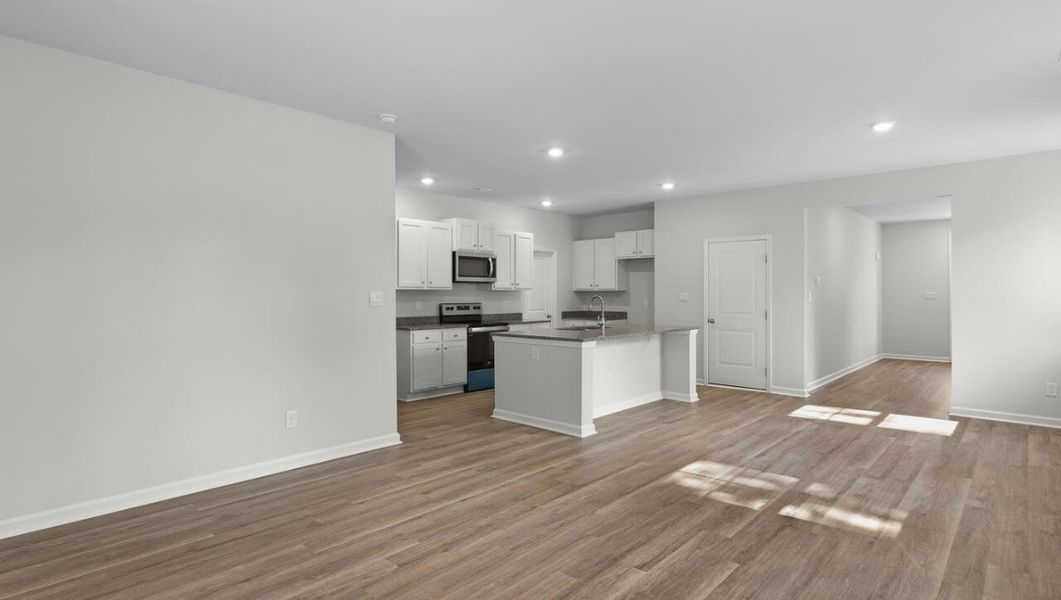 Representative unfurnished interior of a home built from the WOODSTOCK by D.R. Horton in Surfside Landing, Hubert (Image 18).