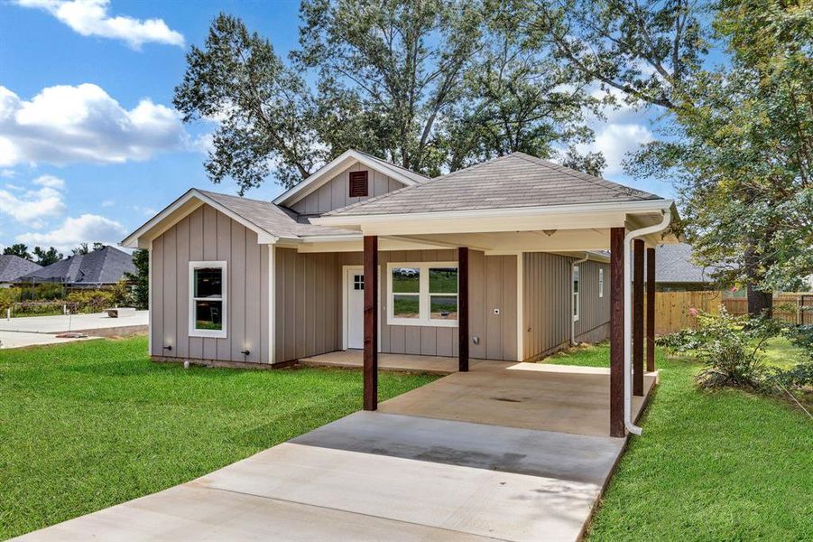 View of front of home featuring board and batten siding, driveway, a shingled roof, and covered porch View of front of home featuring board and batten siding, driveway, a shingled roof, and covered porch