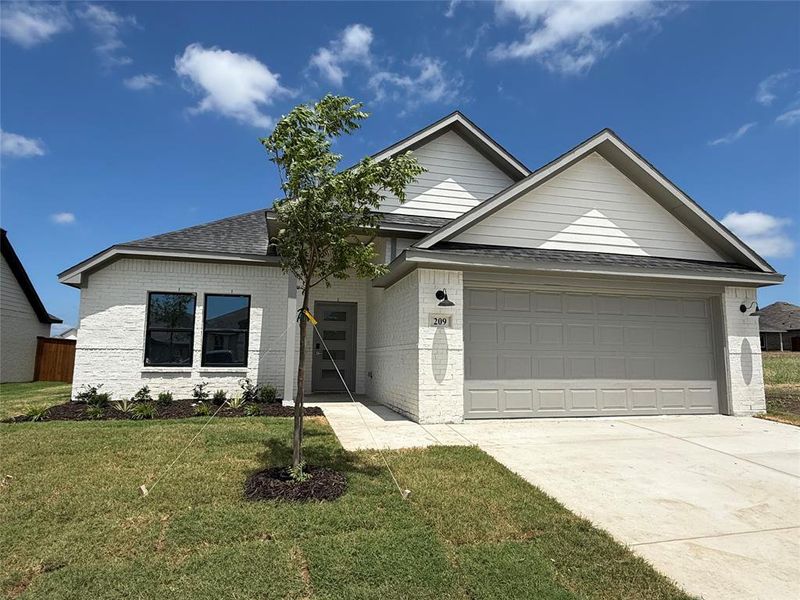 Front exterior of a new home in Stillwater Lake Estates, Godley, TX, highlighting curb appeal (Image 2). Front exterior of a new home in Stillwater Lake Estates, Godley, TX, highlighting curb appeal (Image 2).