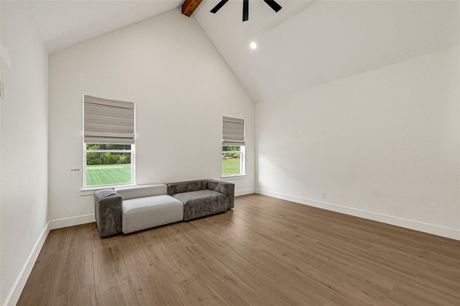 Primary Bedroom. Spacious primary retreat with high ceilings and a bright, airy feel.