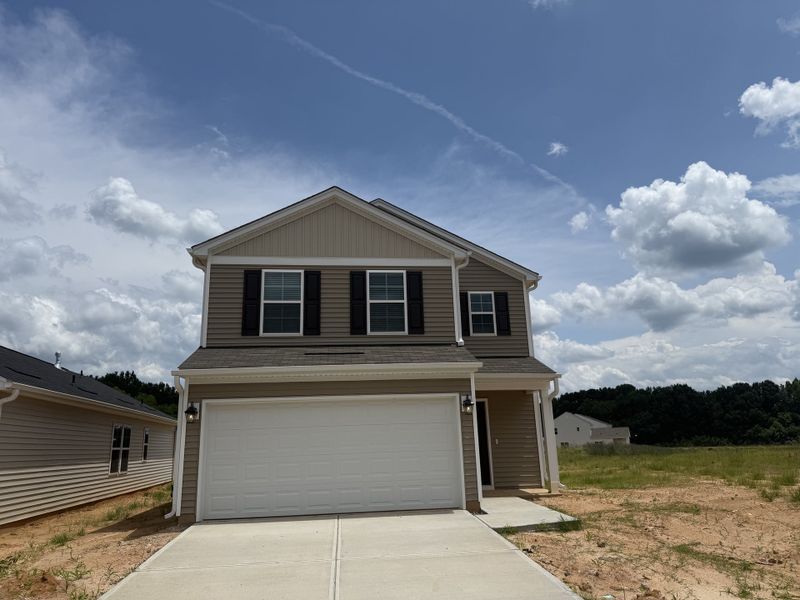 Front exterior of a new home in Laurinton Farms, Hopkins, SC, highlighting curb appeal (Image 1). Front exterior of a new home in Laurinton Farms, Hopkins, SC, highlighting curb appeal (Image 1).