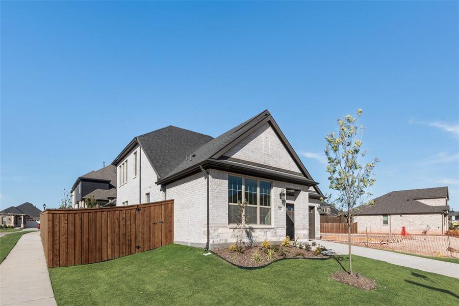 Front exterior of a new home in Villages of Hurricane Creek, Anna, TX, highlighting curb appeal (Image 1). Front exterior of a new home in Villages of Hurricane Creek, Anna, TX, highlighting curb appeal (Image 1).
