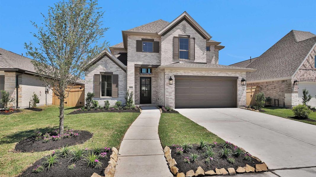 Front exterior of a new home in Sienna, Missouri City, TX, highlighting curb appeal (Image 1). Front exterior of a new home in Sienna, Missouri City, TX, highlighting curb appeal (Image 1).