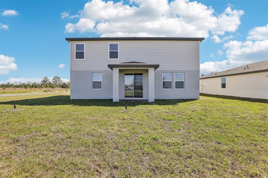 Exterior details and patio area of a home in Lake Deer Estates - Signature Series, Poinciana (Image 4). Exterior details and patio area of a home in Lake Deer Estates - Signature Series, Poinciana (Image 4).