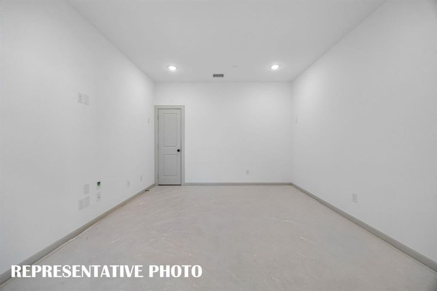 Your spacious media room with adjacent game room creates the ultimate entertainment zone!  REPRESENTATIVE PHOTO