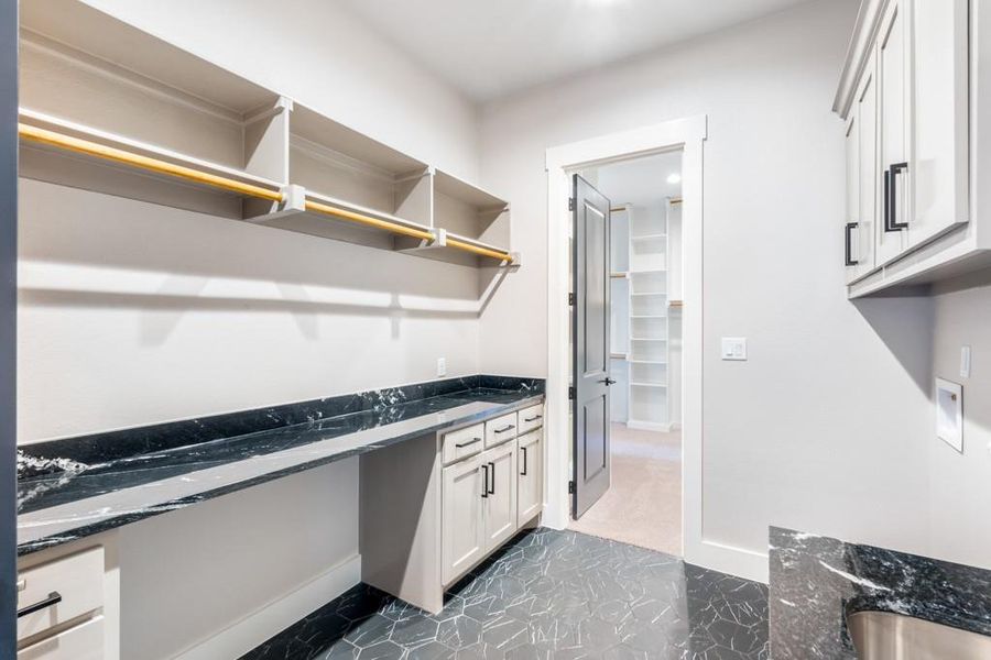 Laundry area featuring cabinets