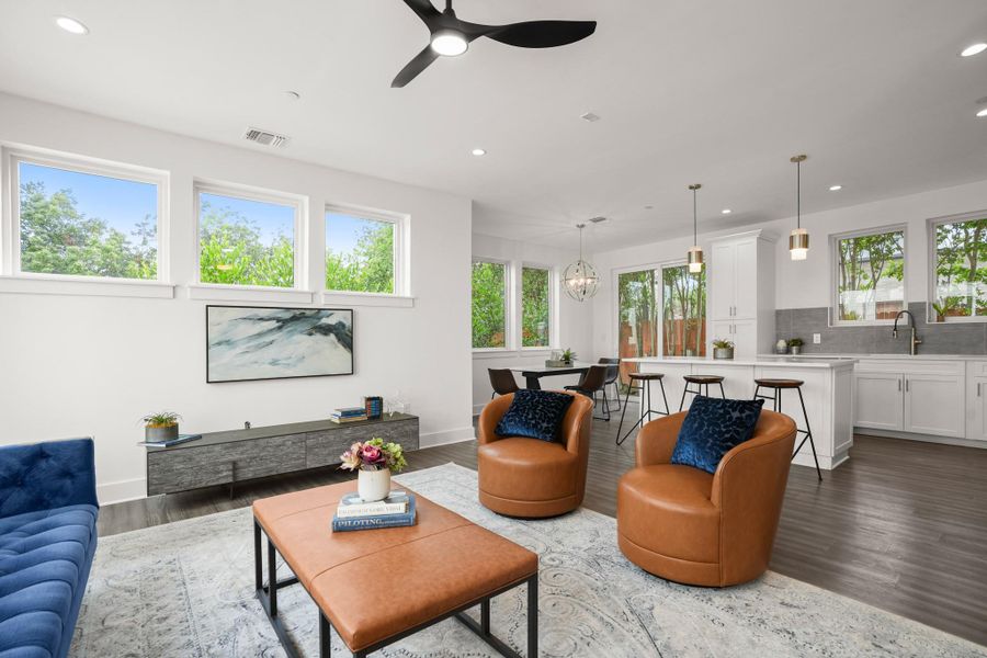 An open-concept living area boasts abundant natural light and seamless transitions between gathering spaces. An open-concept living area boasts abundant natural light and seamless transitions between gathering spaces.