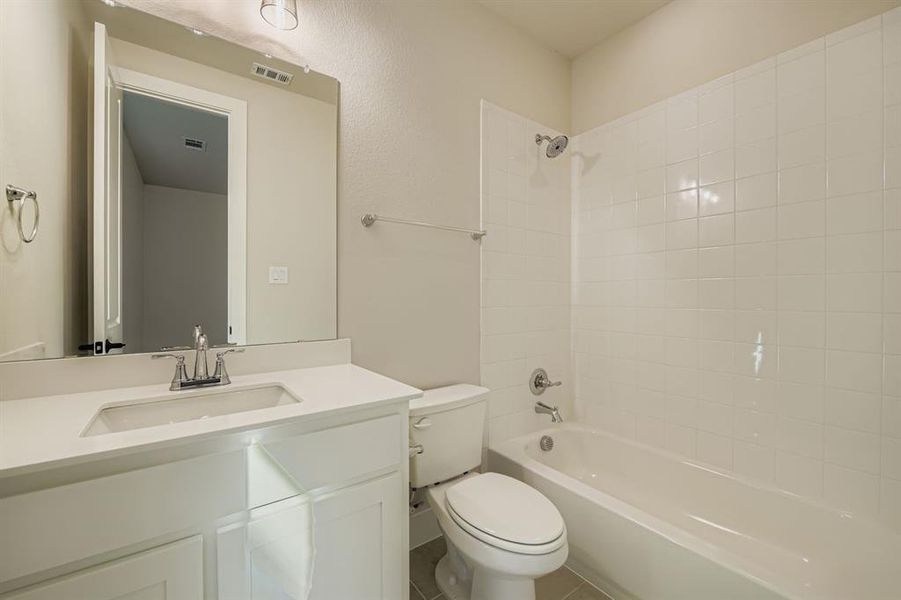 Full bath featuring tub / shower combination and vanity Full bath featuring tub / shower combination and vanity