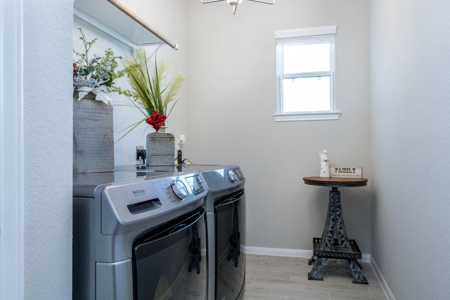 Spacious laundry room with room for folding table or additional refrigerator
