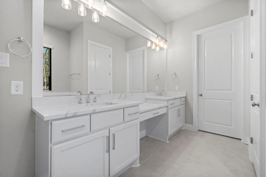 Stunning primary bath with his/her sinks.