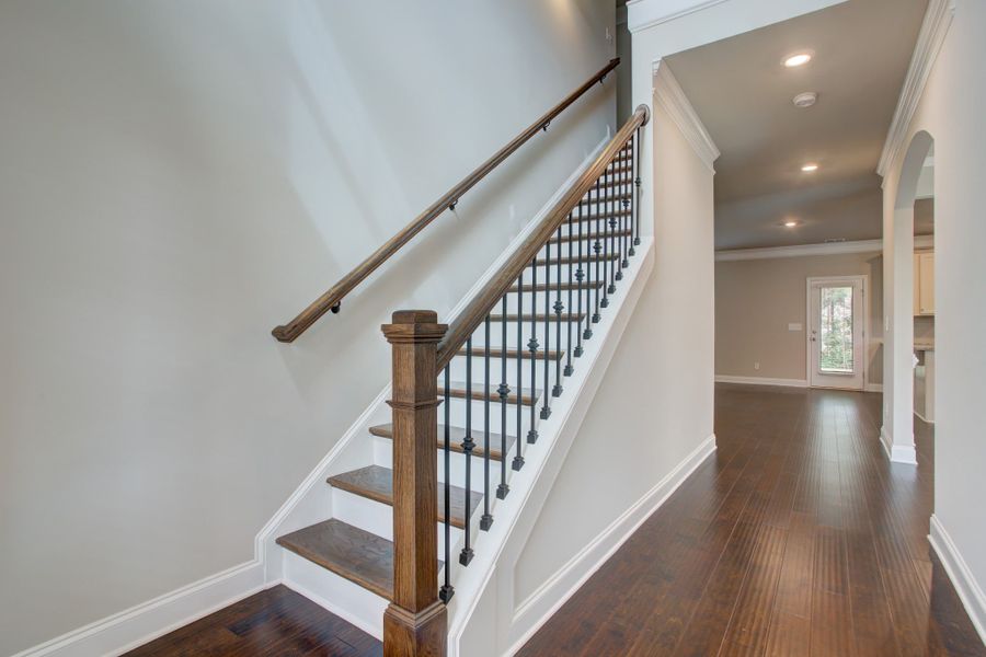 Hall with open stairs greets family and friends