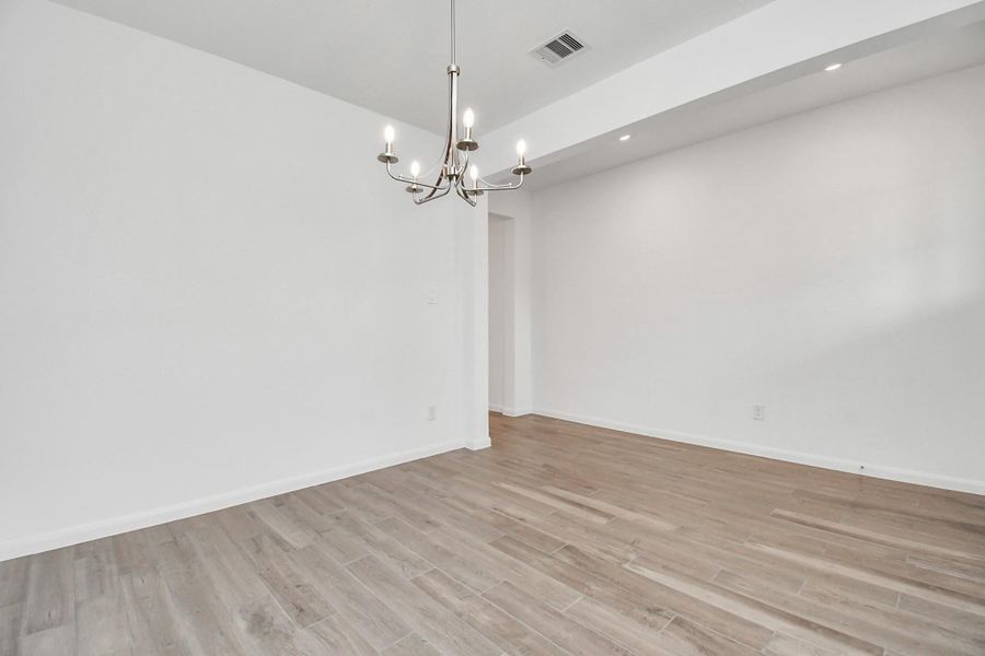 Spacious, unfurnished interior of a new home in Sunterra, Katy (Image 24).