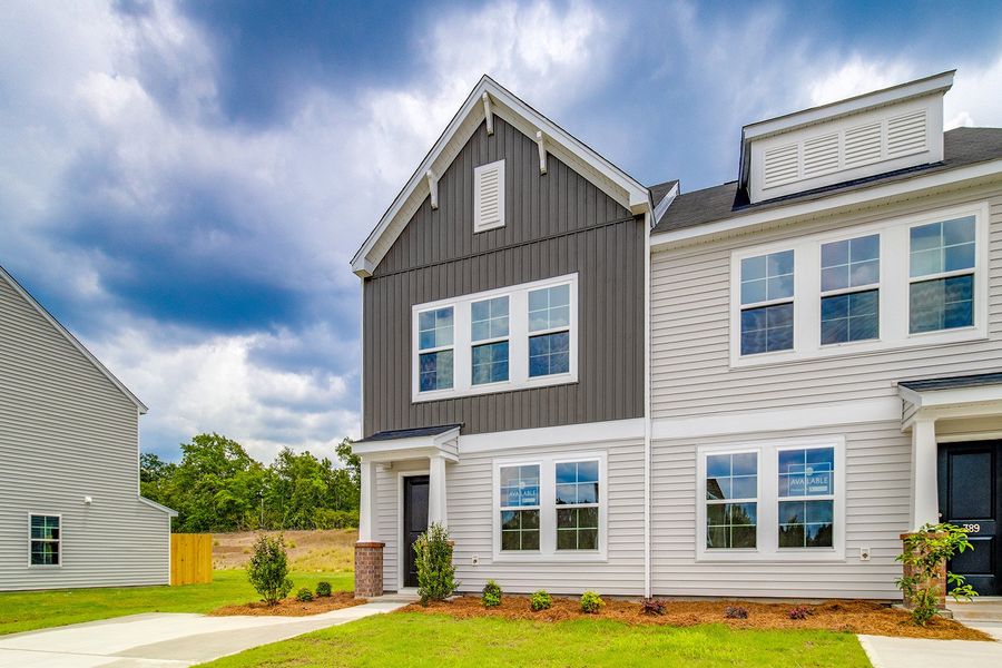 Front exterior of a new home in Padgett Commons, Hopkins, SC, highlighting curb appeal (Image 2). Front exterior of a new home in Padgett Commons, Hopkins, SC, highlighting curb appeal (Image 2).